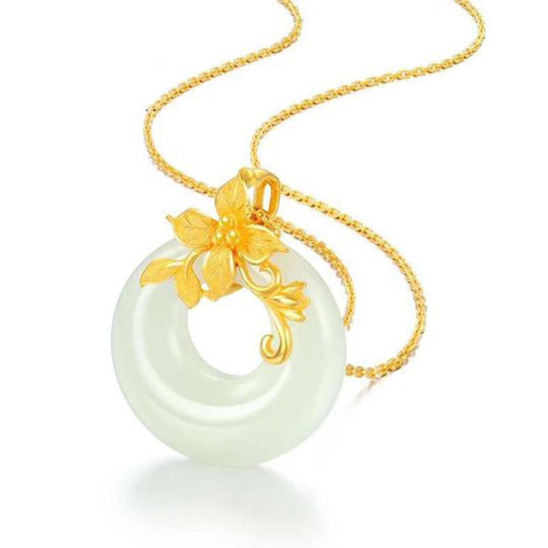 Tibetan White Jade Calm Necklace - angled white background with gold floral bi disc, jade pendant