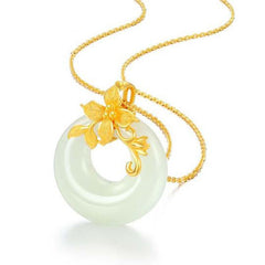 Tibetan White Jade Calm Necklace - angled white background with gold floral bi disc, jade pendant