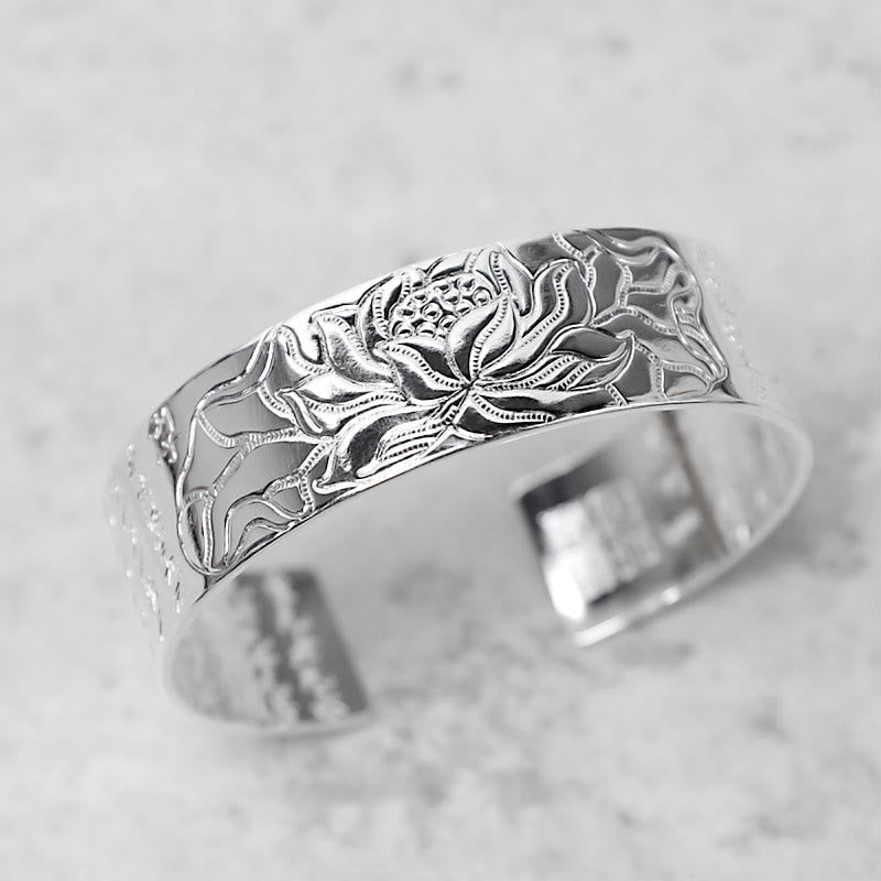 Tibetan Lotus White Copper Luck Bracelet - Silver lotus cuff elevated three-quarter view on marble, Elegant Zen