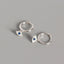 Silver Evil Eye Stud Earrings with Blue Center Stone on Gray Background, Evil Eye Charm