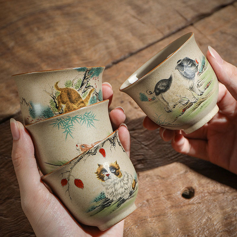 Chinese Zodiac Ceramic Teacup - set of cat dog chick painted cups held in hands, artisan pottery