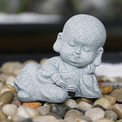 Meditation Monk Statue - Baby monk lying down reading book on pebbles, zen garden decor
