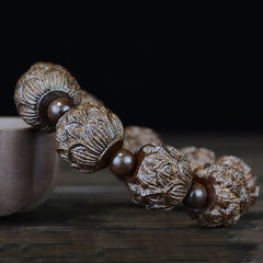Ebony Wood Eighteen Arhats Lotus Dragon Bracelet - Lotus beads on brown ceramic vessel, Artisan Craft