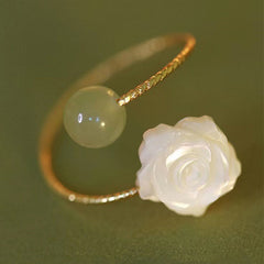 14K Gold Tridacna Jade Rose Ring – Gold open-cuff ring with pale green jade bead and carved white mother-of-pearl rose, olive green textured background