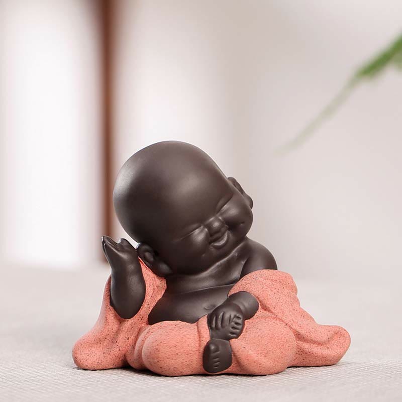Laughing Buddha Purple Clay Maitreya Statue – front view with fists tucked at collarbone, two-tone taupe and light blue-gray robe, playful chibi monk design