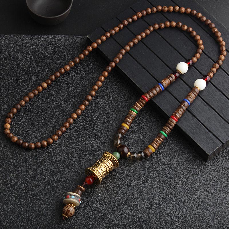 Turquoise Dzi Bead Prayer Wheel Wenge Wood Necklace - 108-bead wood mala with gold-toned prayer wheel pendant, jade accent bead, colored ring spacers, and beaded tassel end