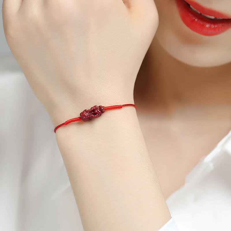 Cinnabar PiXiu Lotus Koi Fish Blessing Braid Bracelet – model wearing PiXiu charm bracelet on wrist, cinnabar lucky animal jewelry
