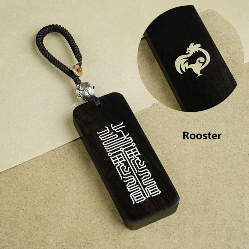 Back side of ebony zodiac keychain featuring Big Dipper celestial talisman script engraving
