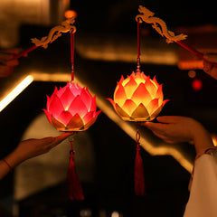 DIY Lotus Dragon Lantern Tassel Lamp – Two pink lotus lanterns with dragon handles held by hands at night, Festive glow