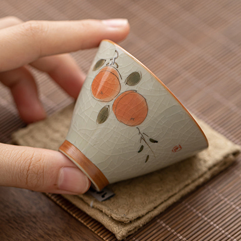 Persimmon Boat Cup – close-up of koi fish painting on glazed ceramic, Chinese tea