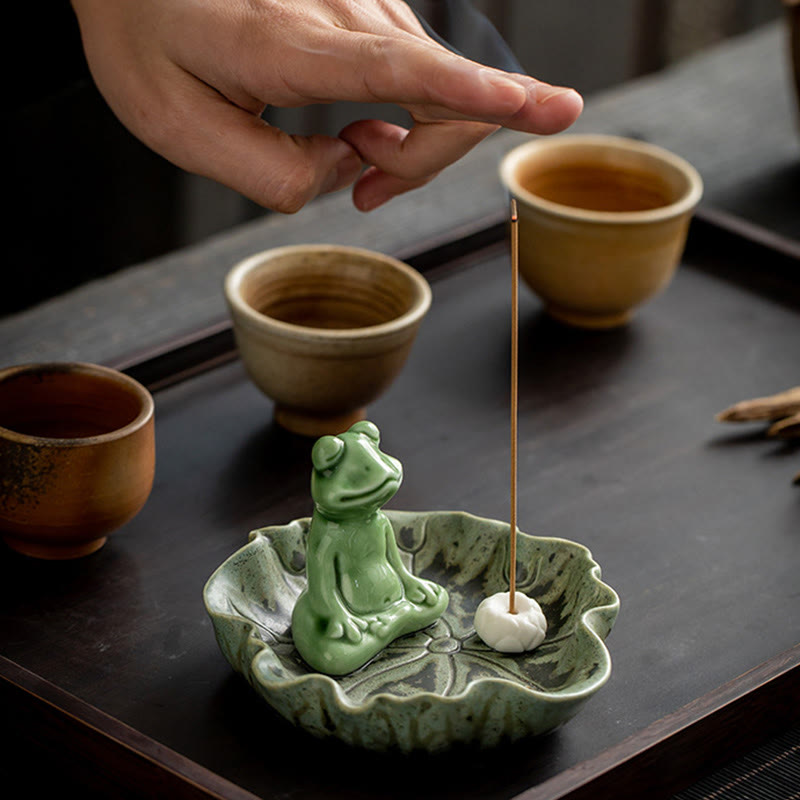 Ceramic Frog Incense Burner – Hand holding cup near burner, Meditative atmosphere