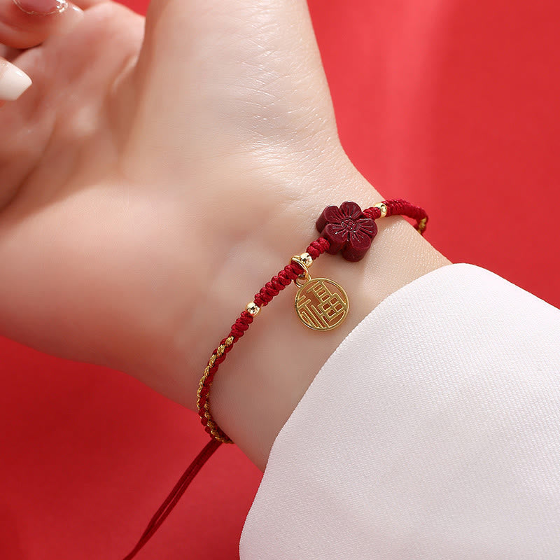 Adjustable red braided cord bracelet with gold fortune Fu charm and burgundy carved flower bead, Chinese traditional blessing jewelry for women