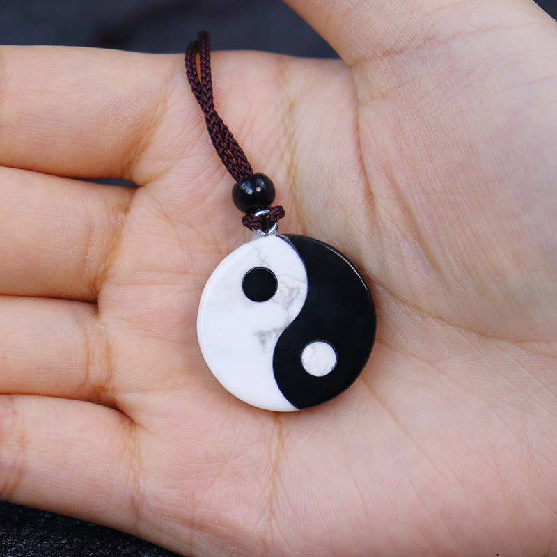 Black Obsidian White Turquoise Yin Yang Strength Fulfilment Necklace Pendant - Obsidian howlite yin-yang pendant in palm, pro