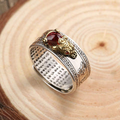 Red Agate PiXiu Wealth Ring – side view silver PiXiu ring with red agate on natural wood, prosperity ring