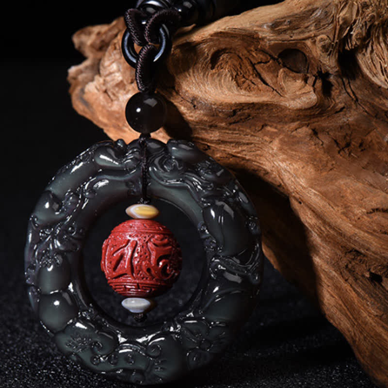 Rainbow Obsidian PiXiu Pendant – Carved rainbow obsidian ring with red cinnabar bead, wood bg