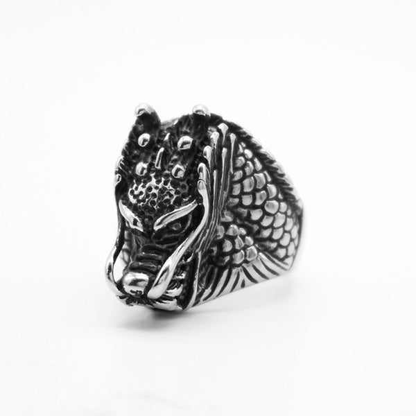 Dragon Balance Titanium Steel Ring – front view with pointed horns and flame details on white, fantasy