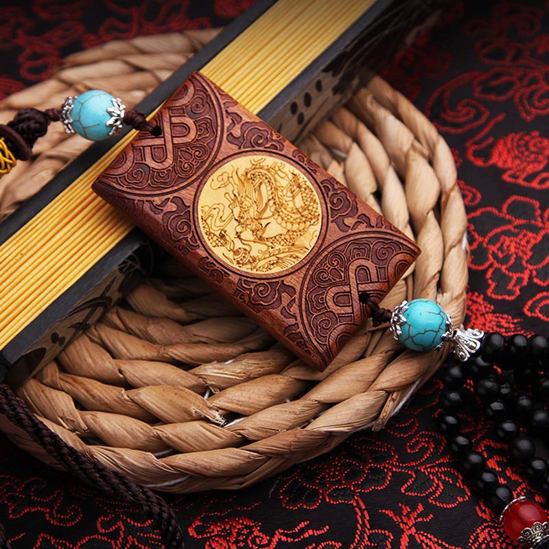 Rosewood Dragon Decoration – carved golden dragon medallion with turquoise beads on cord, Luck