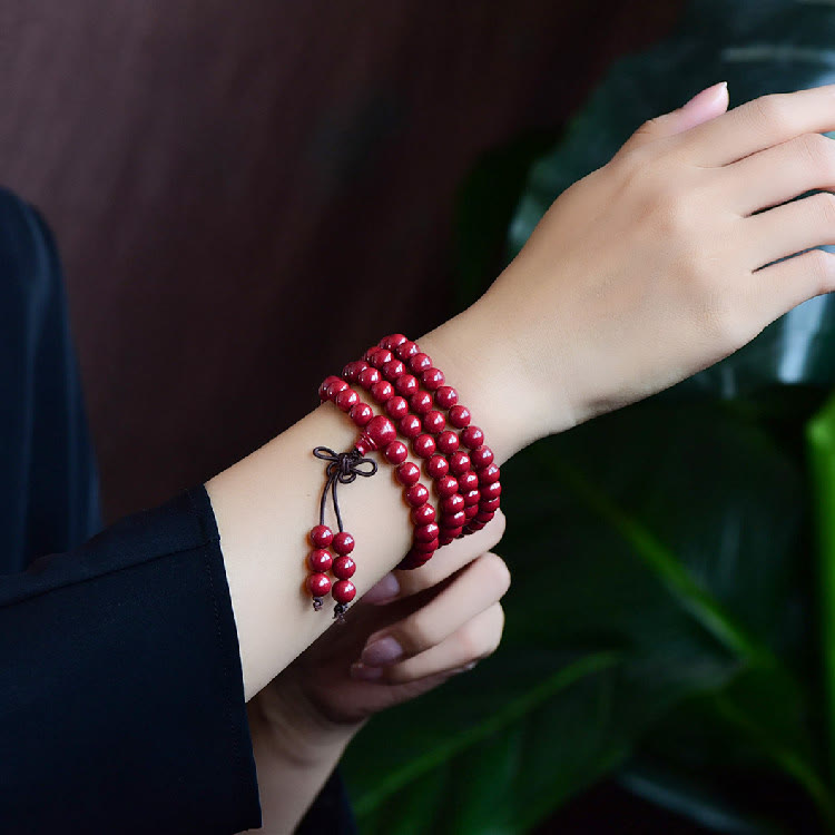 108 Mala Beads Cinnabar Bracelet – Wrist wear with cord closure, red bead tassels