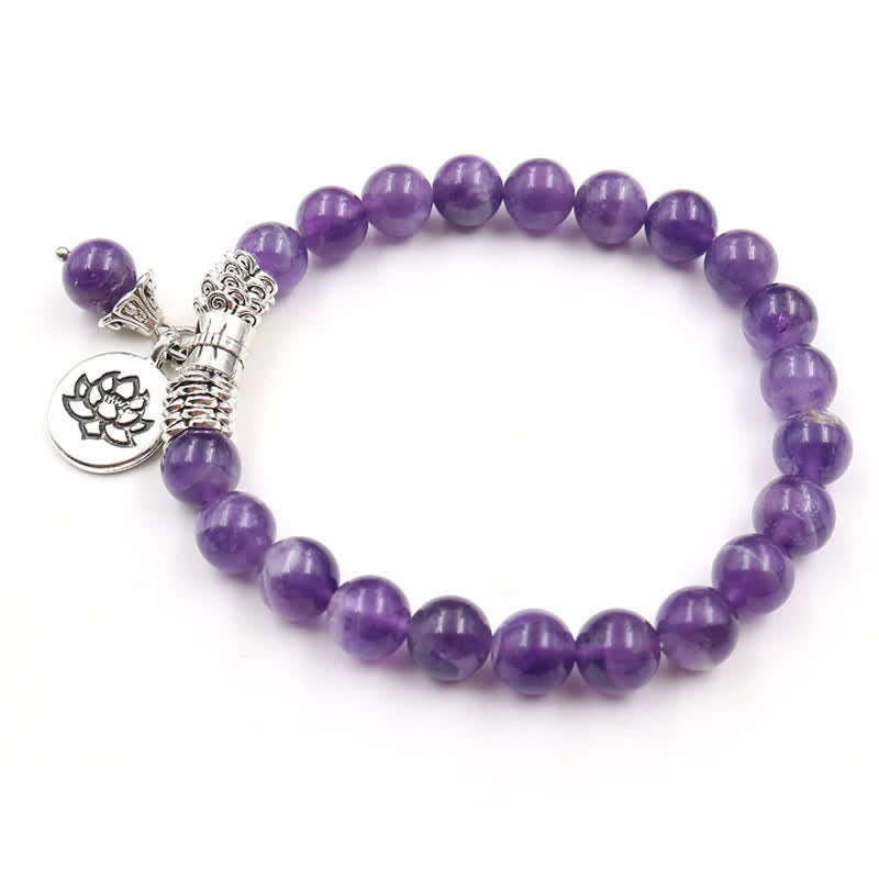 Amethyst Lotus Bracelet - flat lay white background, metal spacer cluster and lotus charm