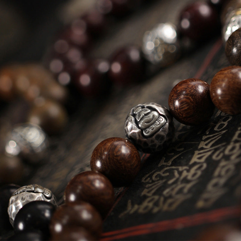 999 Sterling Silver Sandalwood Buddha Bracelet – Multiple sandalwood bracelets with silver Buddha beads arranged together
