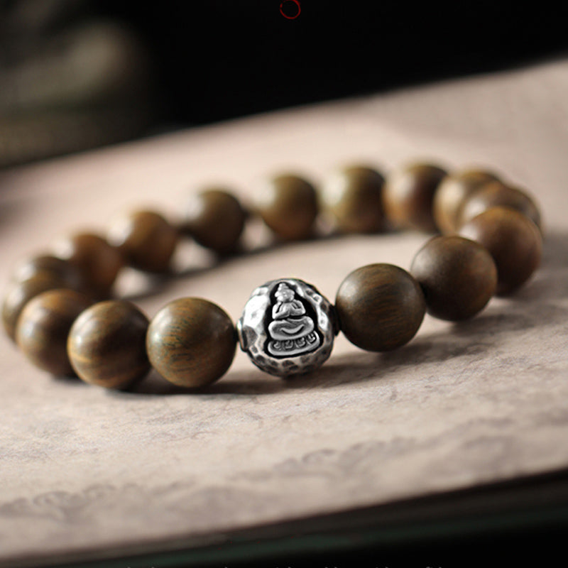 999 Sterling Silver Sandalwood Buddha Bracelet – Green sandalwood beads with silver Buddha centerpiece, tranquil design