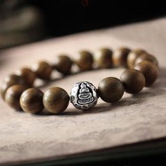 999 Sterling Silver Sandalwood Buddha Bracelet – Green sandalwood beads with silver Buddha centerpiece, tranquil design