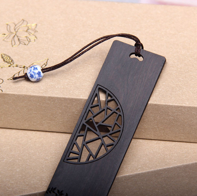 Tree of Life Wood Bookmarks - close-up of dark wood bookmark with lattice pattern and blue porcelain bead