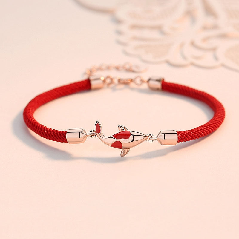 Gold Plated Koi Fish Bracelet - Front view of koi charm on braided rope, feng shui jewelry
