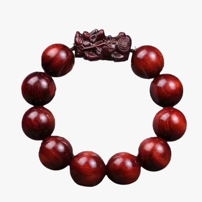 Red Sandalwood PiXiu Bracelet – Isolated red sandalwood bracelet with carved PiXiu on white, protection