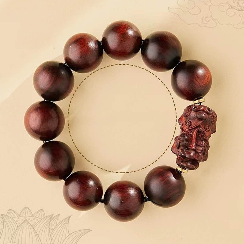 Red Sandalwood PiXiu Bracelet – Bracelet on beige background with dashed circle and lotus outline, meditation