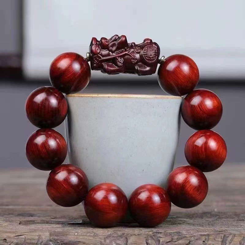 Red Sandalwood PiXiu Bracelet – Wooden beads with PiXiu wrapped around grey ceramic cup, calming jewelry