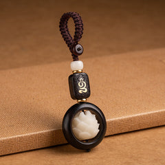 Ebony Wood Bodhi Seed Lotus Key Chain - carved lotus in dark wood frame, kraft paper styling
