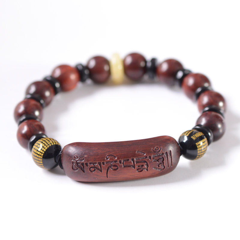 Red Sandalwood Om Bracelet – upright loop on white background, full view with mantra bead and gold accents, mens wood bracelet