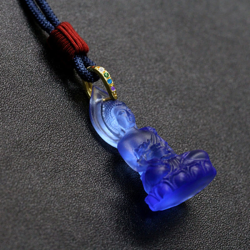 Blue Tathagata Medicine Buddha Liuli Crystal Necklace – gradient cobalt to sky blue reclining Buddha pendant, gold bail with colored stones, dark textured surface