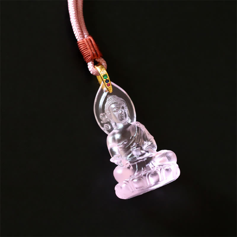 Blue Tathagata Medicine Buddha Liuli Crystal Necklace – yellow-amber citrine Buddha pendant on golden braided cord, red knot accent, dark gray matte surface glow