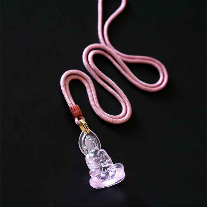 Blue Tathagata Medicine Buddha Liuli Crystal Necklace – golden translucent laughing Buddha variant on yellow cord, red wrap and colored stone metal fitting, charcoal backdrop