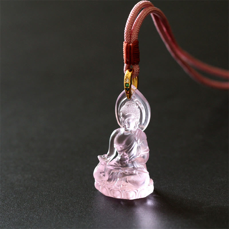 Blue Tathagata Medicine Buddha Liuli Crystal Necklace – clear crystal Buddha pendant with pink braided cord and red knot wrap, gold fitting, solid black background