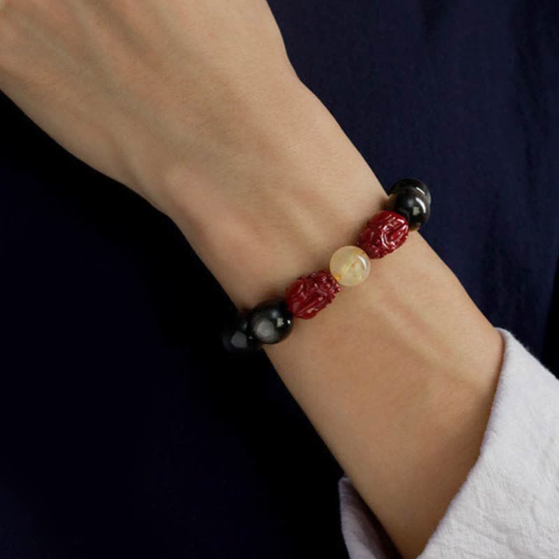 Gold Sheen Obsidian Pixiu Bracelet – wrist model front view on dark background, obsidian protection bracelet fit display