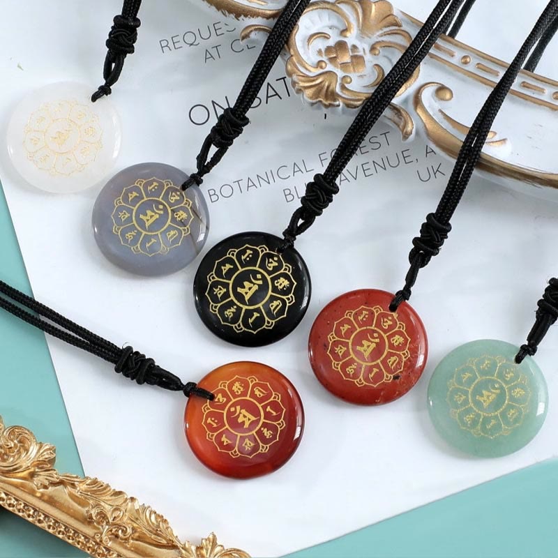 Om Mani Padme Hum Necklace – Six crystal pendants in editorial flat-lay with gold accents, multi-stone collection