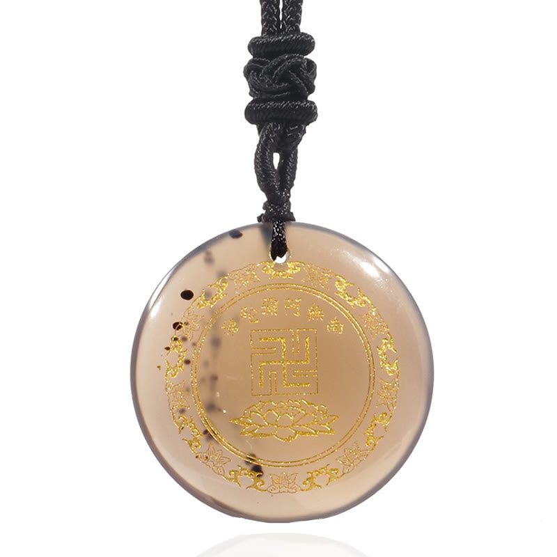 Smoky Quartz Purification Pendant - gray-brown translucent stone gold swastika & lotus on white, clean studio
