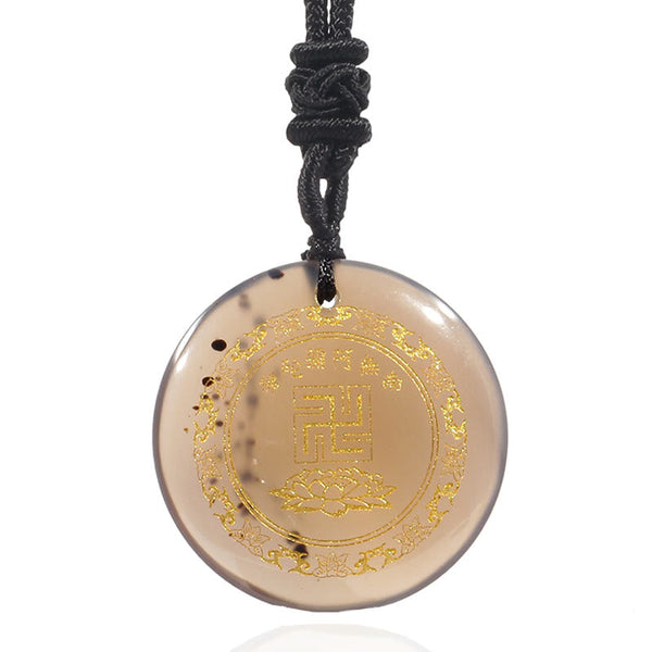 Smoky Quartz Purification Pendant - gray-brown translucent stone gold swastika & lotus on white, clean studio
