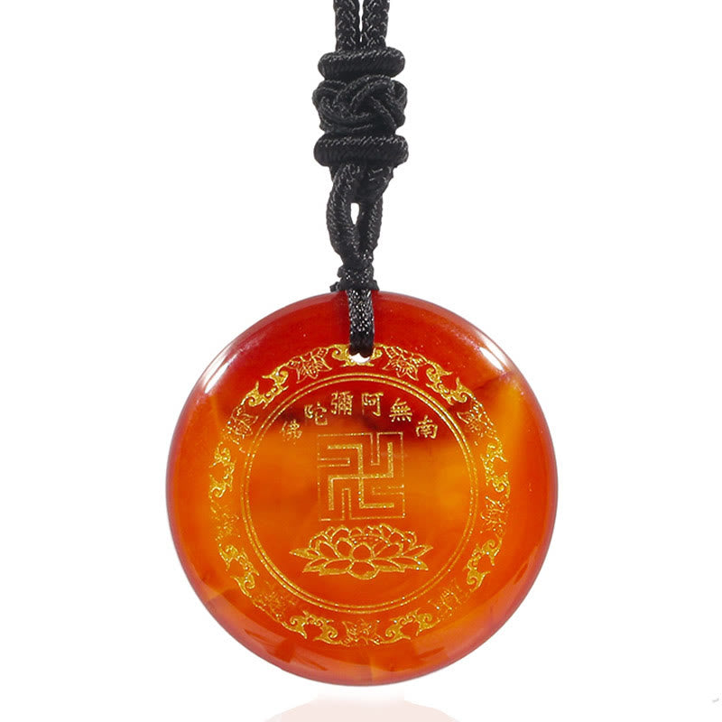 Carnelian Purification Pendant - orange agate gold Buddhist icons straight-on white, natural banding visible
