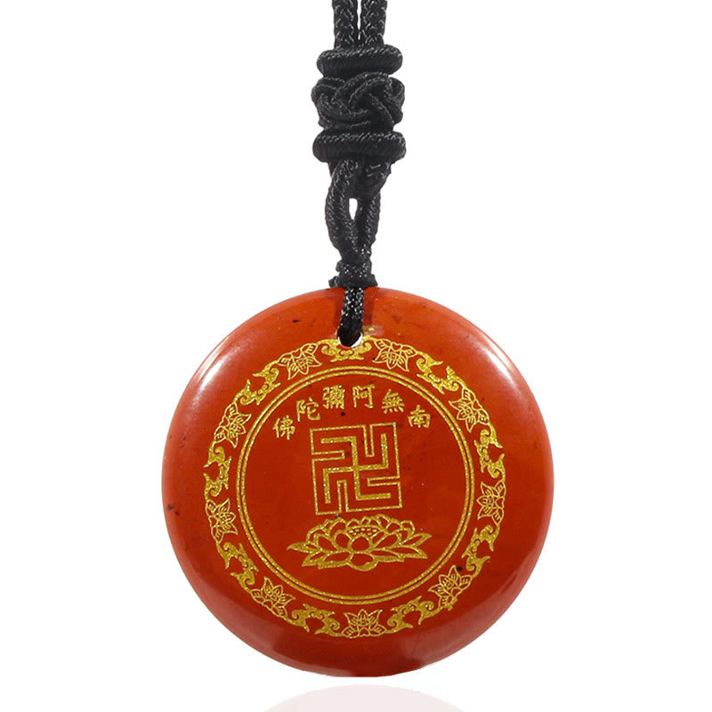 Carnelian Red Purification Pendant - translucent red agate gold swastika & lotus on white, studio shot