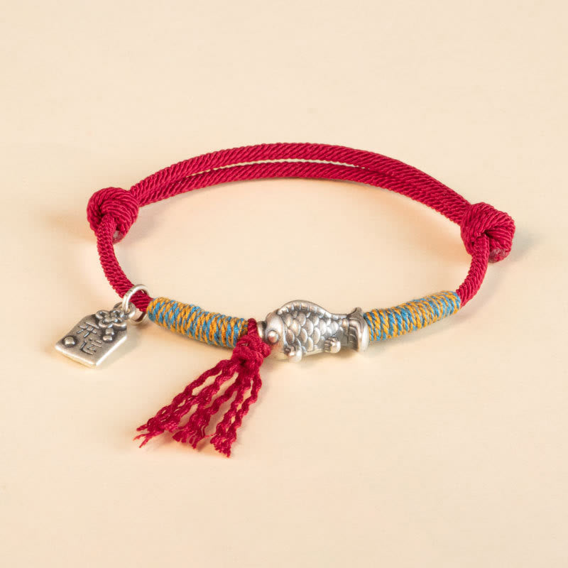 Silver Koi Bracelet – Worn on wrist showing red string and koi charm fit