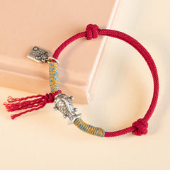 Silver Koi Bracelet – Red string bracelet with silver koi on wrist, adjustable