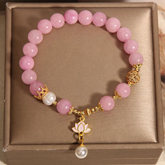 Pink Quartzite Pearl Lotus Bracelet - overhead view in gift box with crown and pearl accents, Gift-Ready