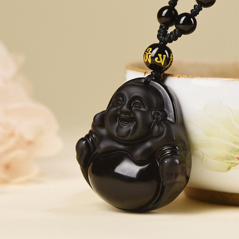 Black Obsidian Buddha Necklace – Buddha on white background emphasizing pure black stone contrast