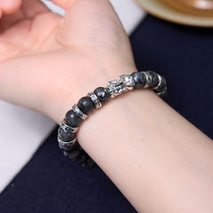 Black Glitter PiXiu Power Bracelet – Black stone and silver pixiu bracelet worn on wrist, power bracelet