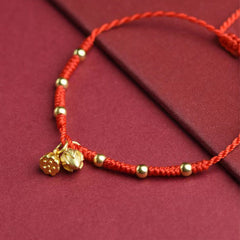 Lotus Charm Red Anklet – Gold lotus bud and bloom charms on red cord, anklet