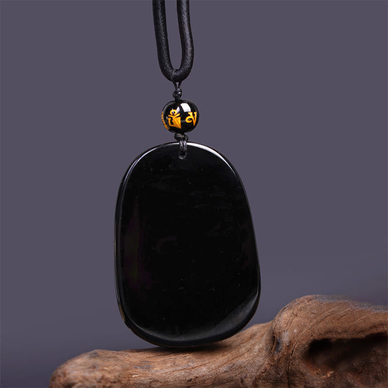Black Obsidian Dragon Carved Pendant – Polished tablet stone with gold-inscribed mantra bead, healing